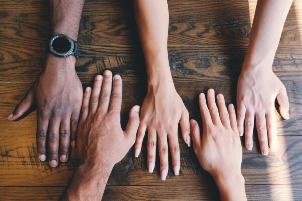 five different hands united