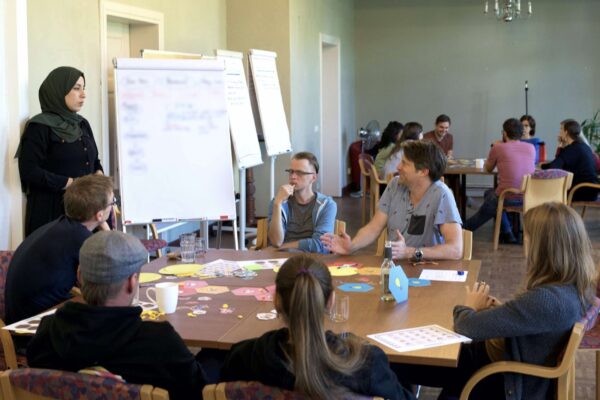 IMITO workshop between several people from different companies with women and men from different backgrounds and cultures.